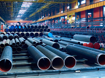 View inside of an industrial piping facility showcasing several racks of piping ductwork