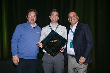 Company leadership with the award
